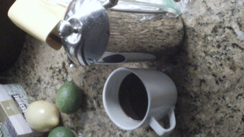Photo of coffee cup with french press