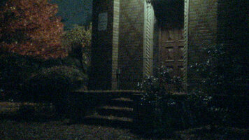 Photo of a church door at night