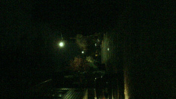 Photo of a street lit by street lamps at night